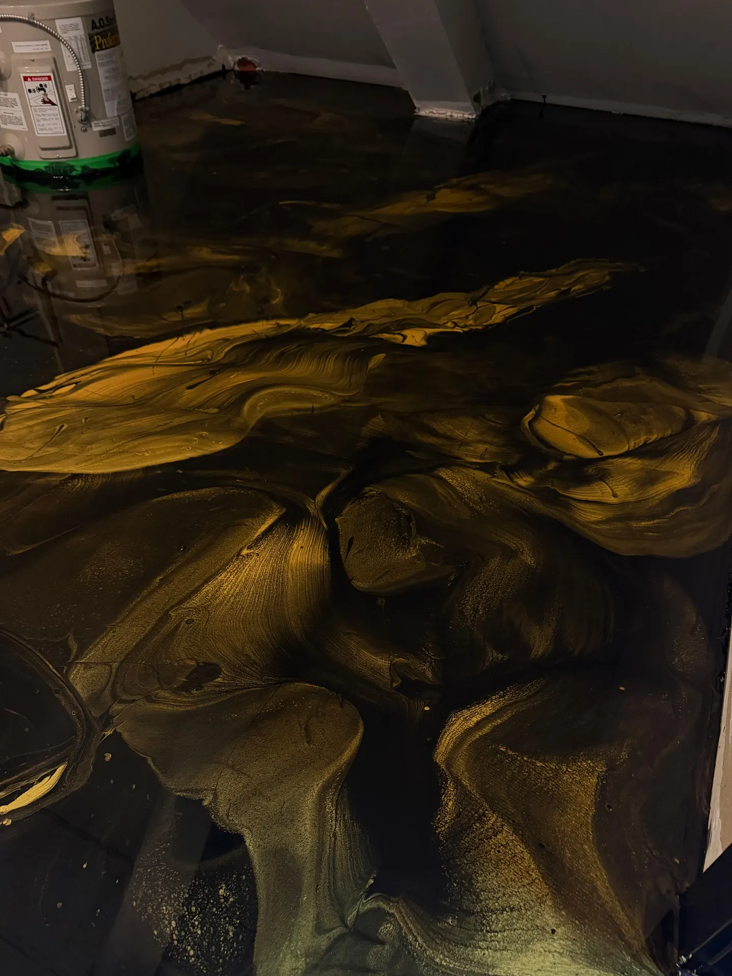 Black and gold metallic epoxy floor, by Westside Mogul Resin in Calgary