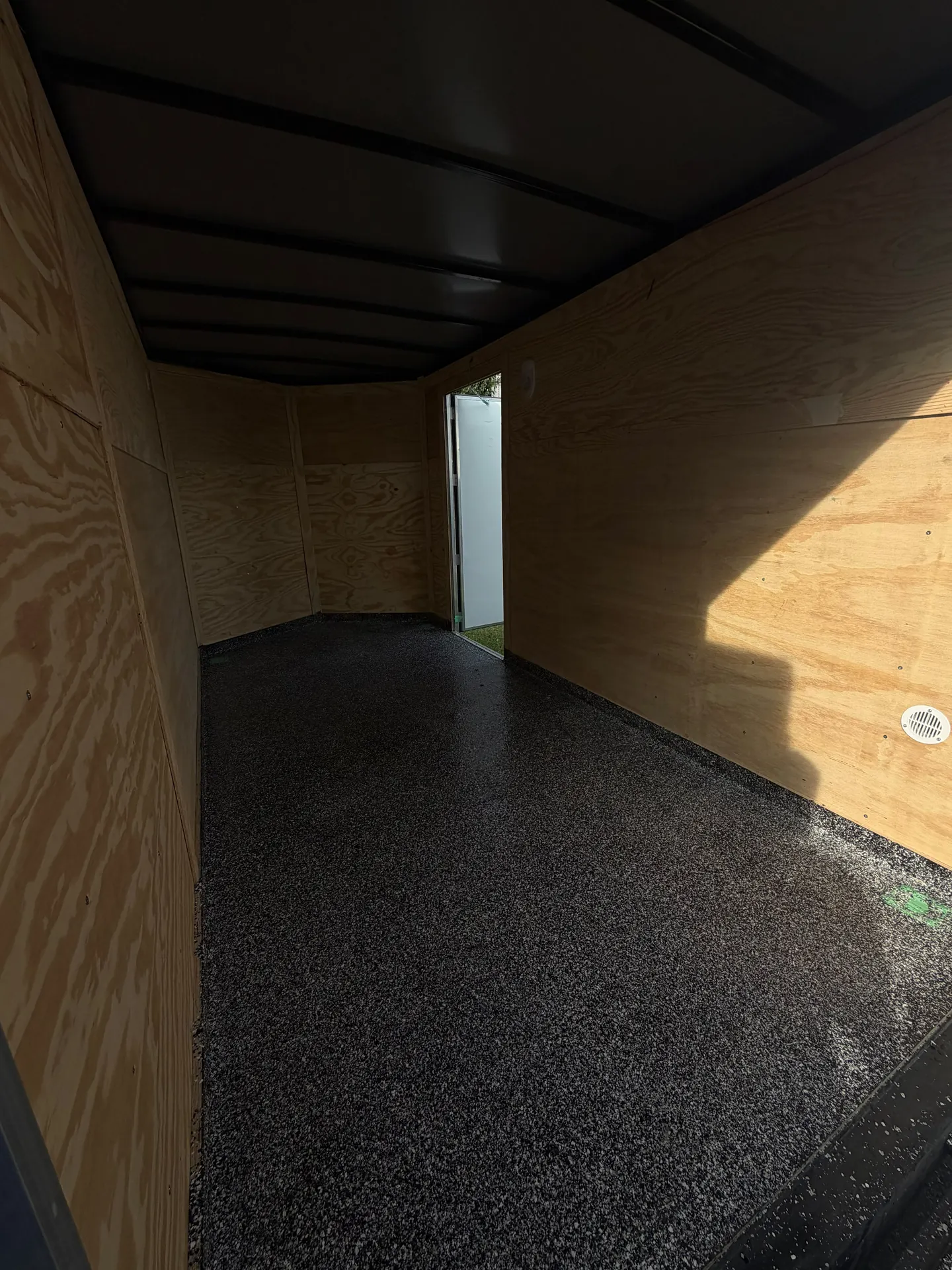 Grey flake epoxy cargo trailer floor, by Westside Mogul Resin in Calgary
