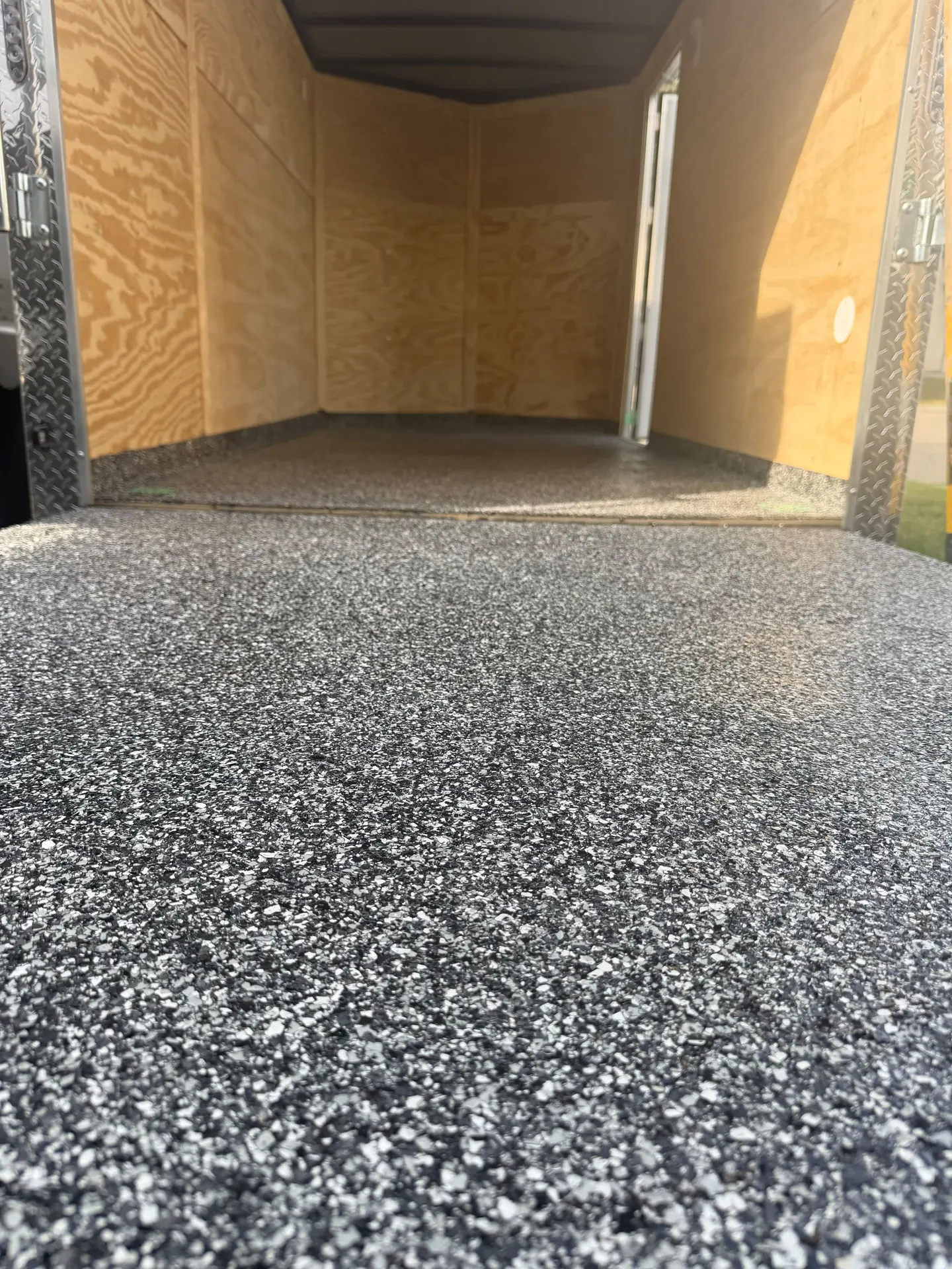 Grey flake epoxy cargo trailer floor, by Westside Mogul Resin in Calgary