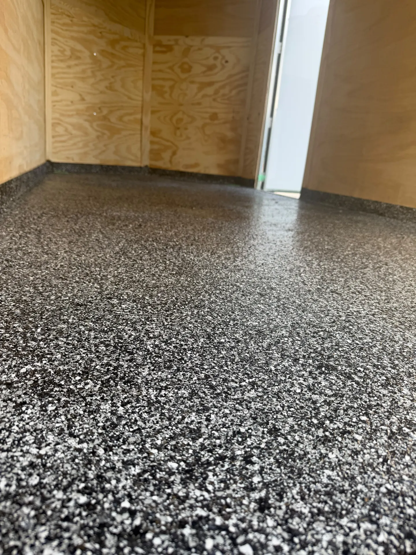 Grey flake epoxy cargo trailer floor, by Westside Mogul Resin in Calgary
