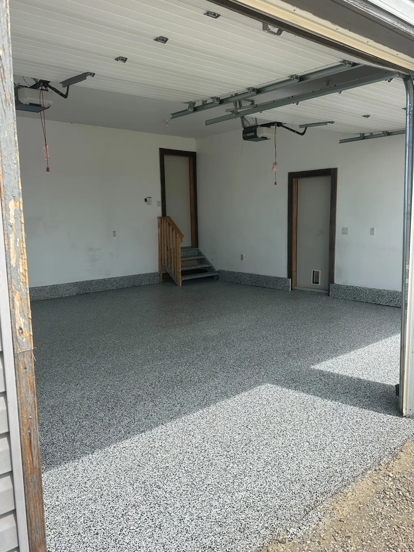 Grey flake epoxy garage floor on an acreage, by Westside Mogul Resin in Calgary