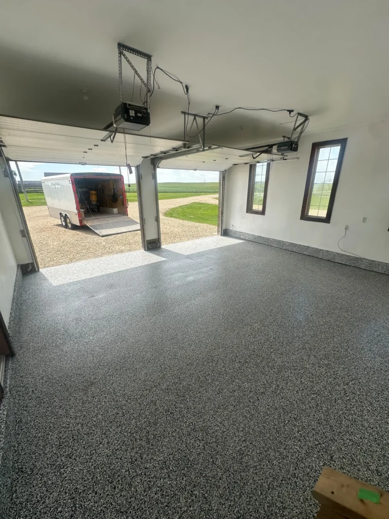 Grey flake epoxy garage floor on an acreage, by Westside Mogul Resin in Calgary