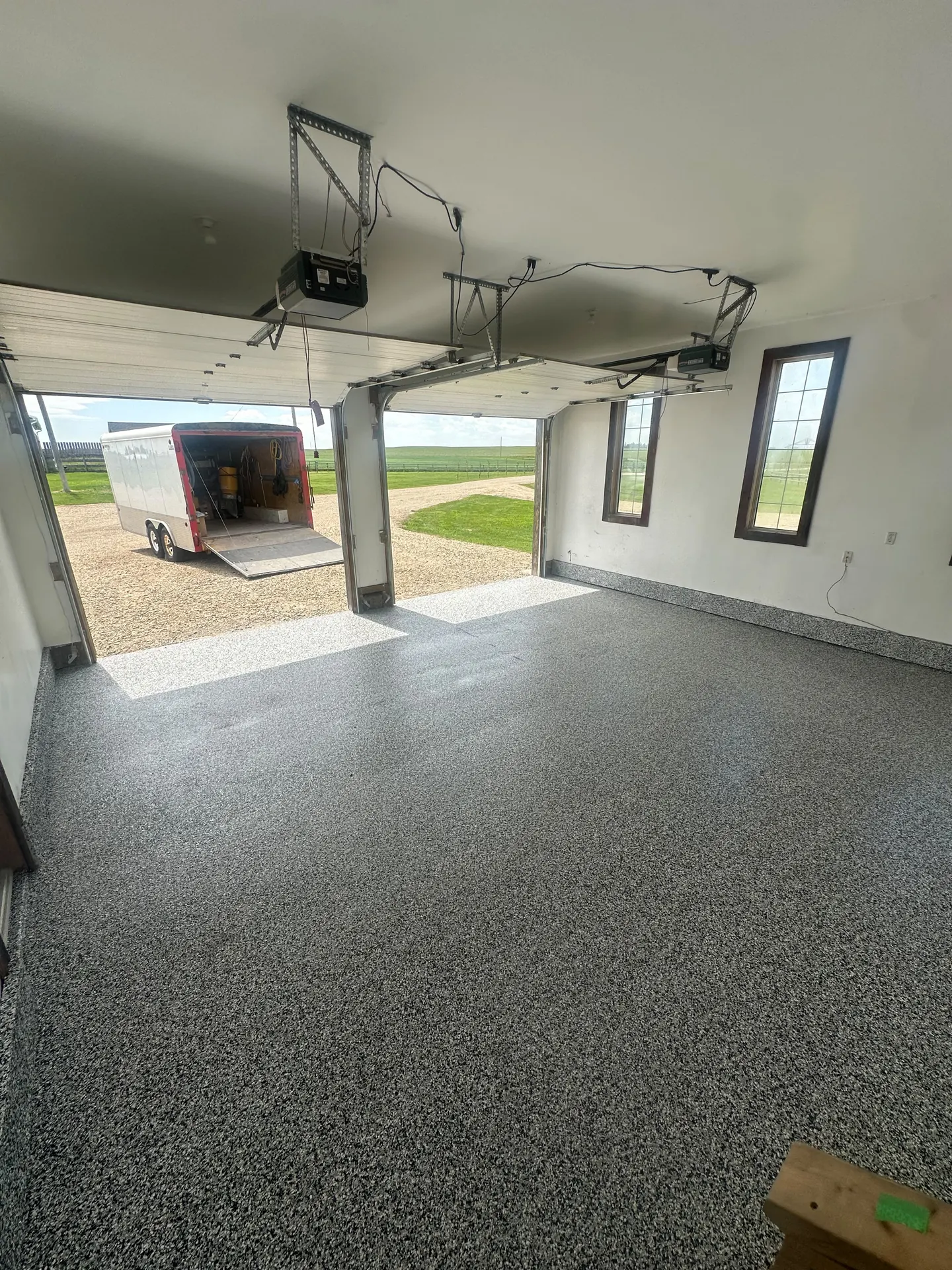Grey flake epoxy garage floor on an acreage, by Westside Mogul Resin in Calgary