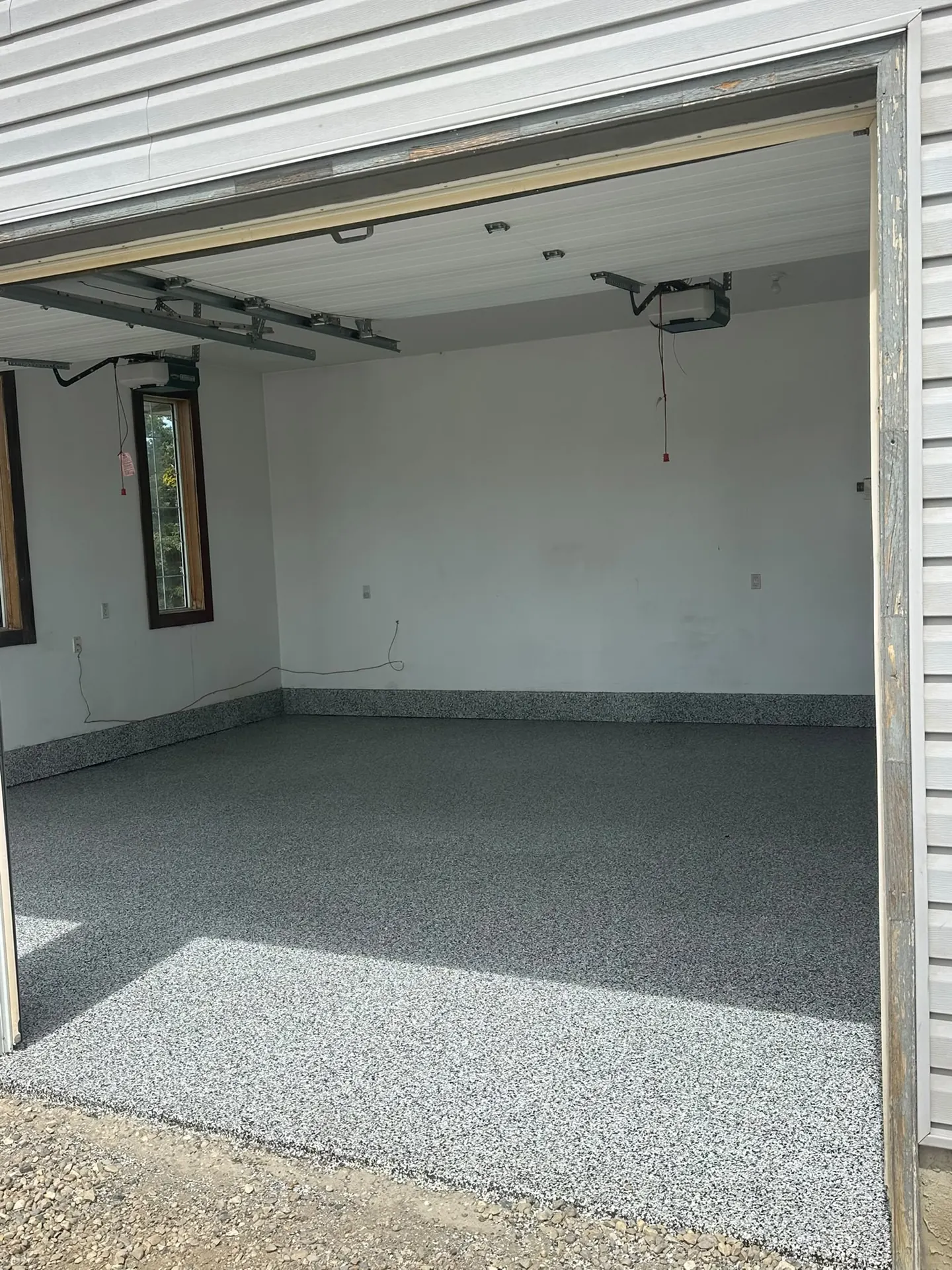 Grey flake epoxy garage floor on an acreage, by Westside Mogul Resin in Calgary