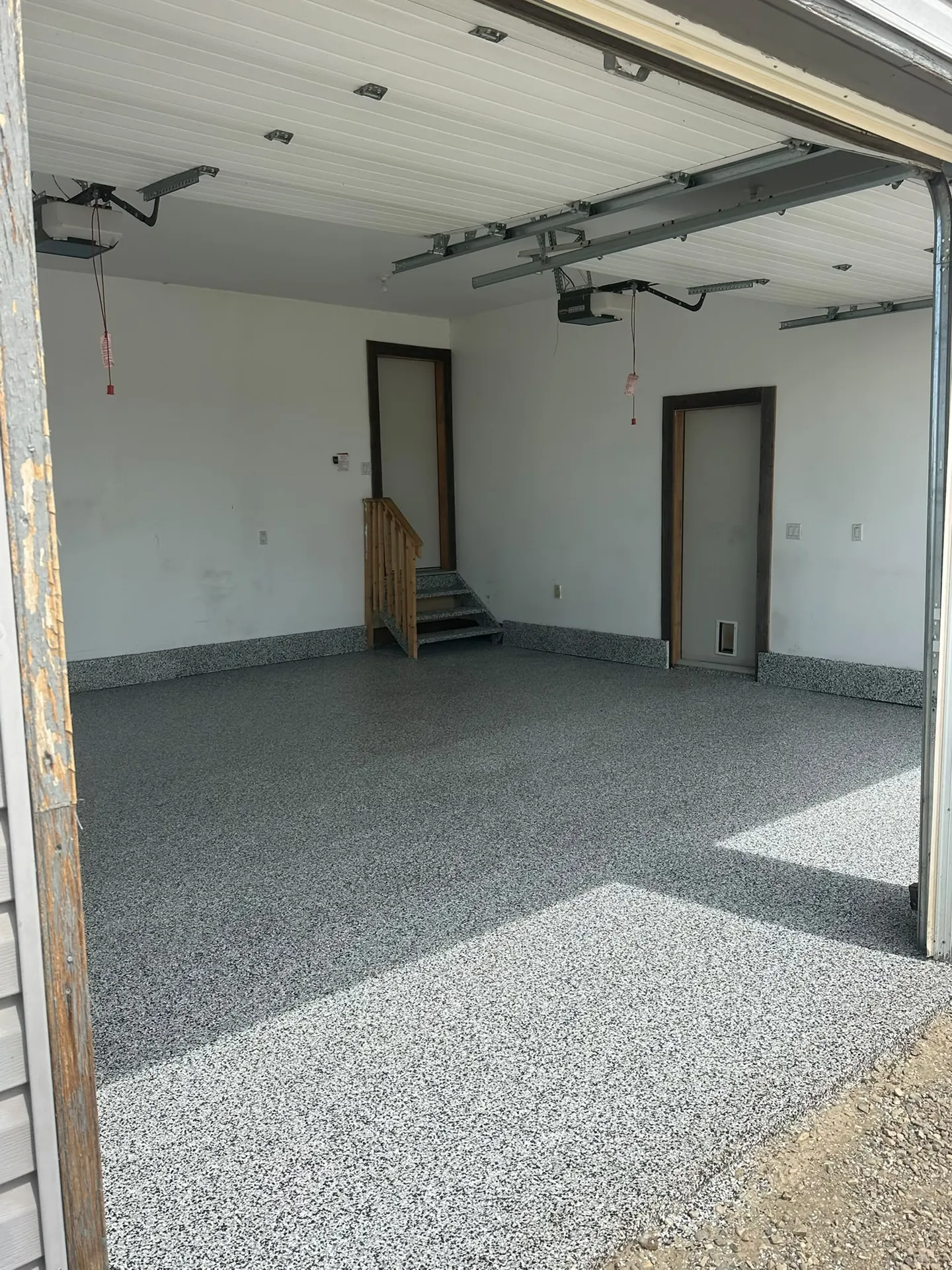 Grey flake epoxy garage floor on an acreage, by Westside Mogul Resin in Calgary