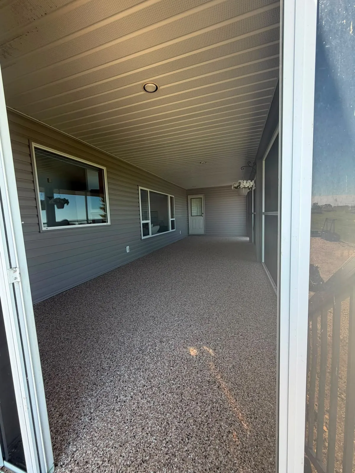 Flake epoxy sunroom patio floor, by Westside Mogul Resin in Calgary