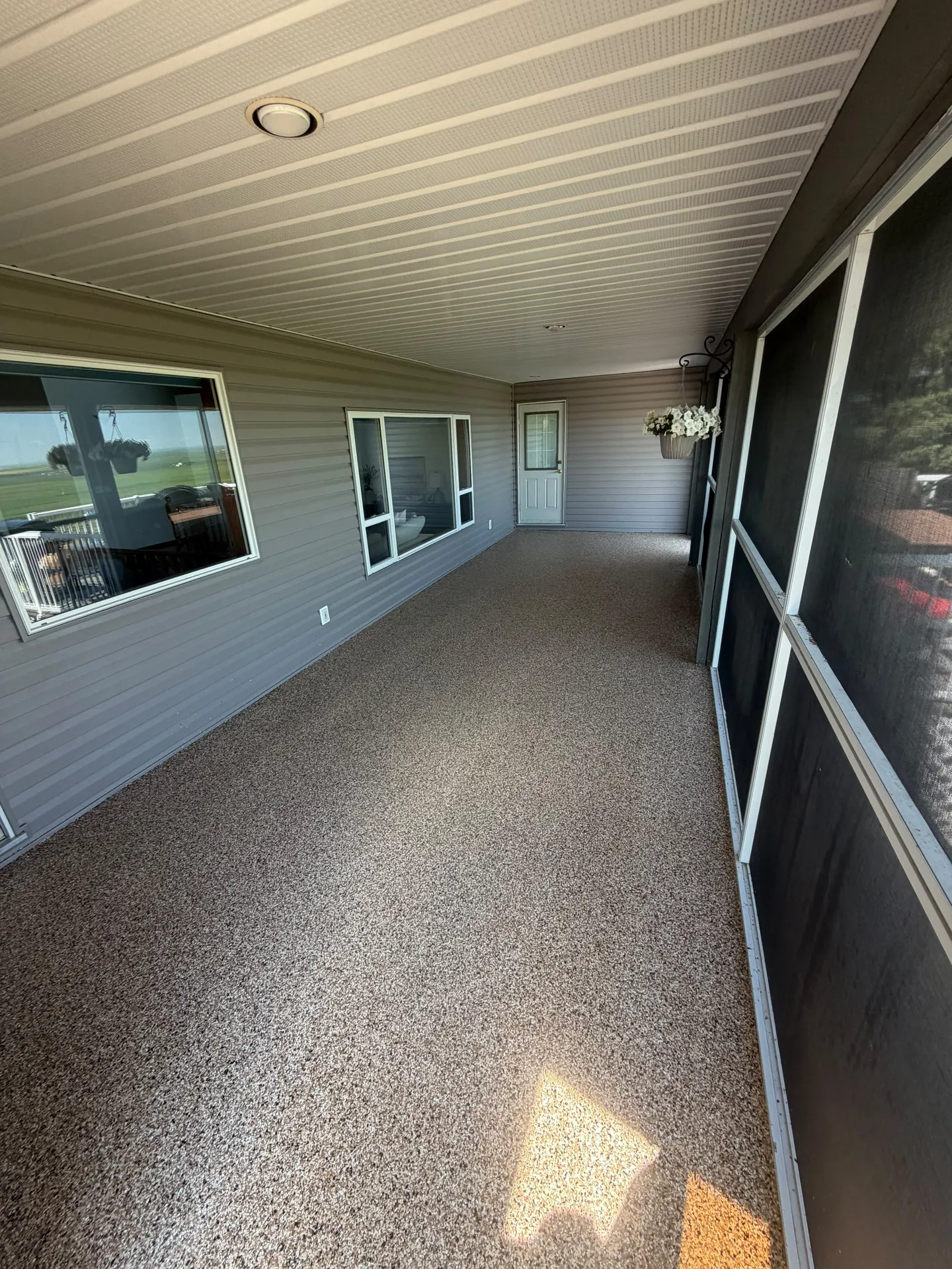 Flake epoxy sunroom patio floor, by Westside Mogul Resin in Calgary