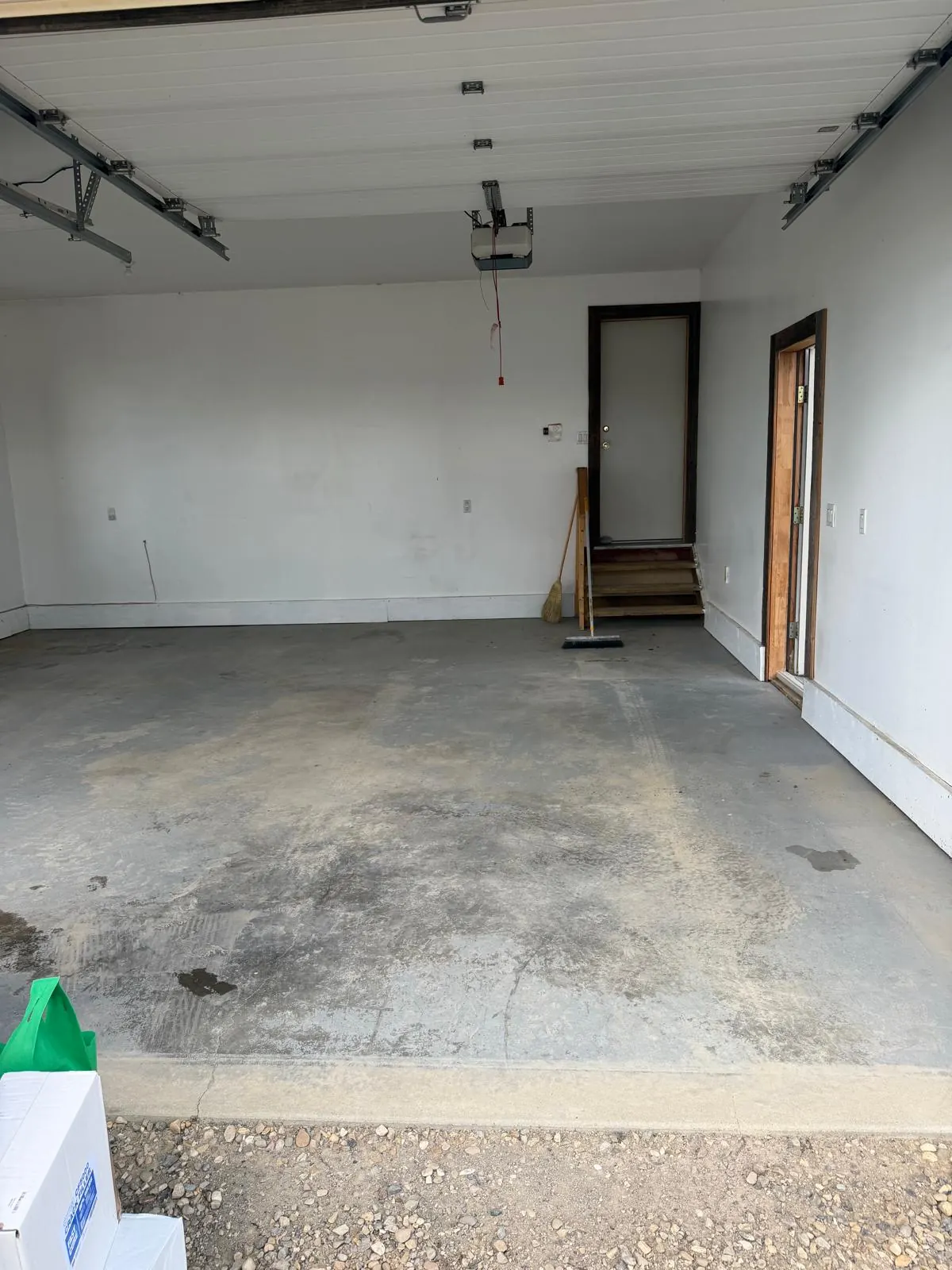 Stained garage concrete before epoxy, by Westside Mogul Resin in Calgary