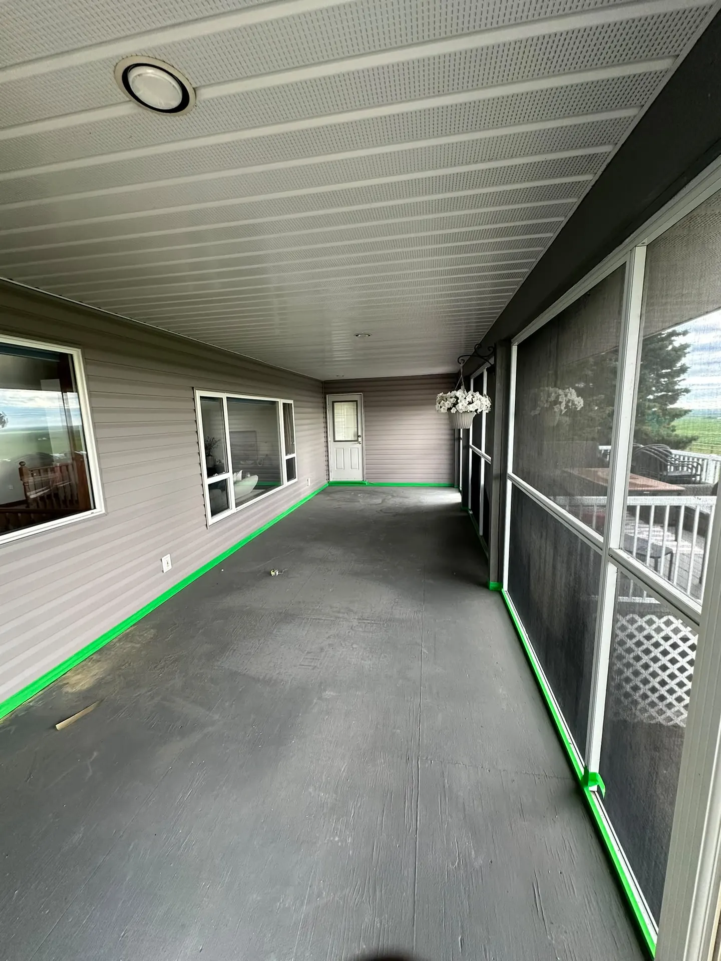 Sunroom patio floor prepped before flake epoxy, by Westside Mogul Resin in Calgary