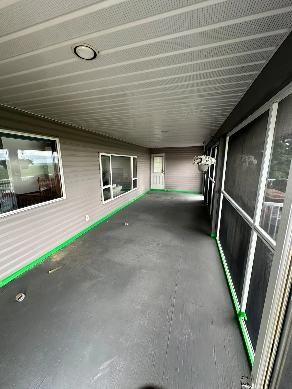 Sunroom patio floor prepped before flake epoxy, by Westside Mogul Resin in Calgary